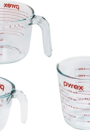 Pyrex 3-piece glass measuring cup set showing 1-cup, 2-cup, and 4-cup sizes with red ounce and milliliter markings, easy-grip handles, and pouring spouts. Tempered glass, microwave and dishwasher safe.
